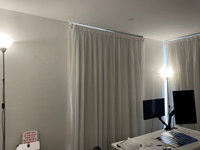 Sheer White Curtain In The Window