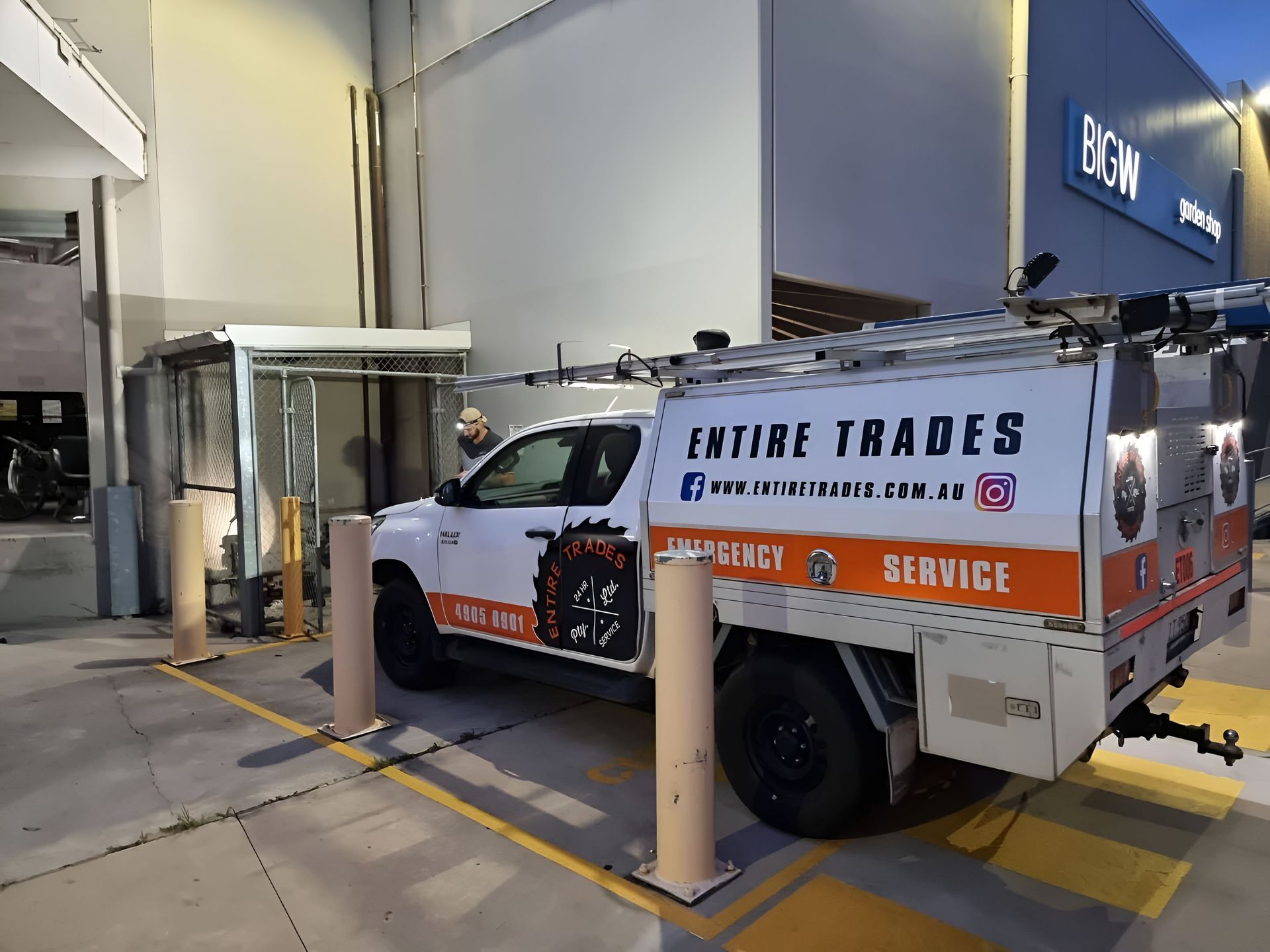 A Work Ute Is Parked On Concrete In Front Of A Building — Entire Power Solutions In Belmont, NSW