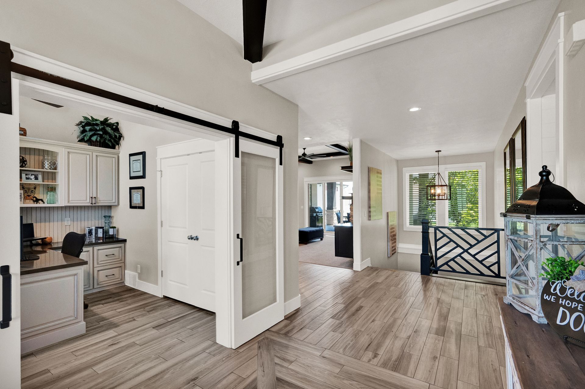 There is a sliding barn door between the kitchen and the living room.