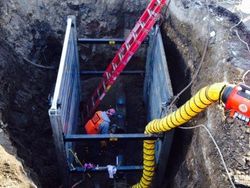 Men working in hole — Excavating Specialists in Laporte, CO