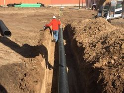 excavating hole for pipe — Excavating Specialists in Laporte, CO