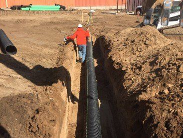 excavating hole for pipe — Excavating Specialists in Laporte, CO
