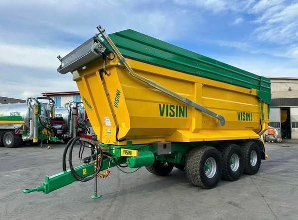 Un camion con cassone ribaltabile giallo e verde con la scritta visini sopra