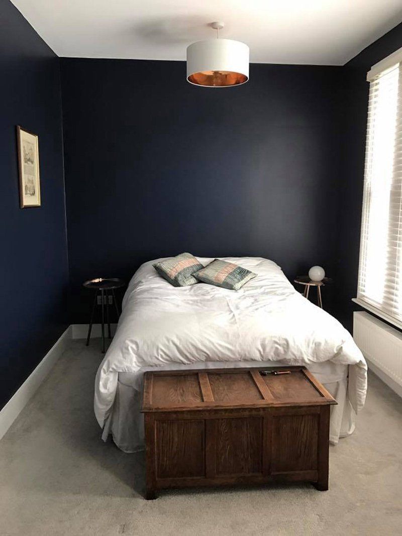 double bedroom dark blue back wall