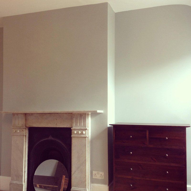 white wall and fireplace