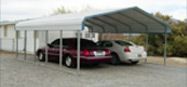 Two cars are parked under a carport.