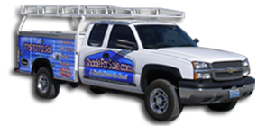 A white truck with a ladder on top of it