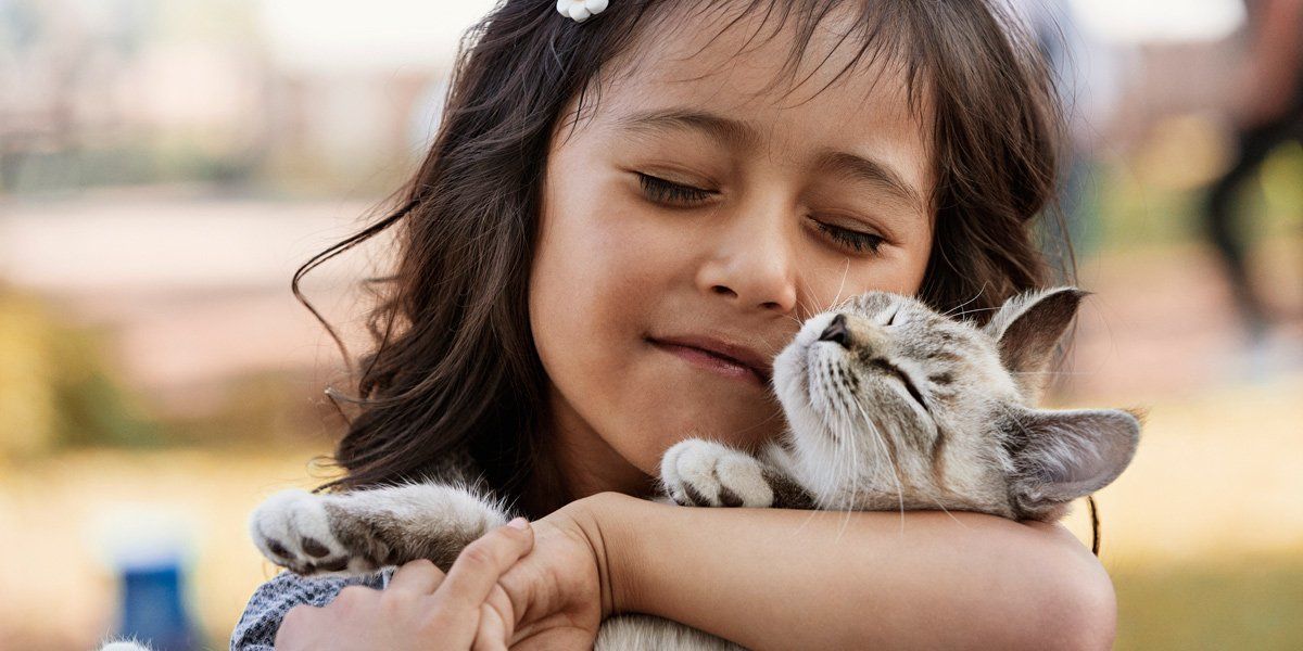 woman smiling with cat