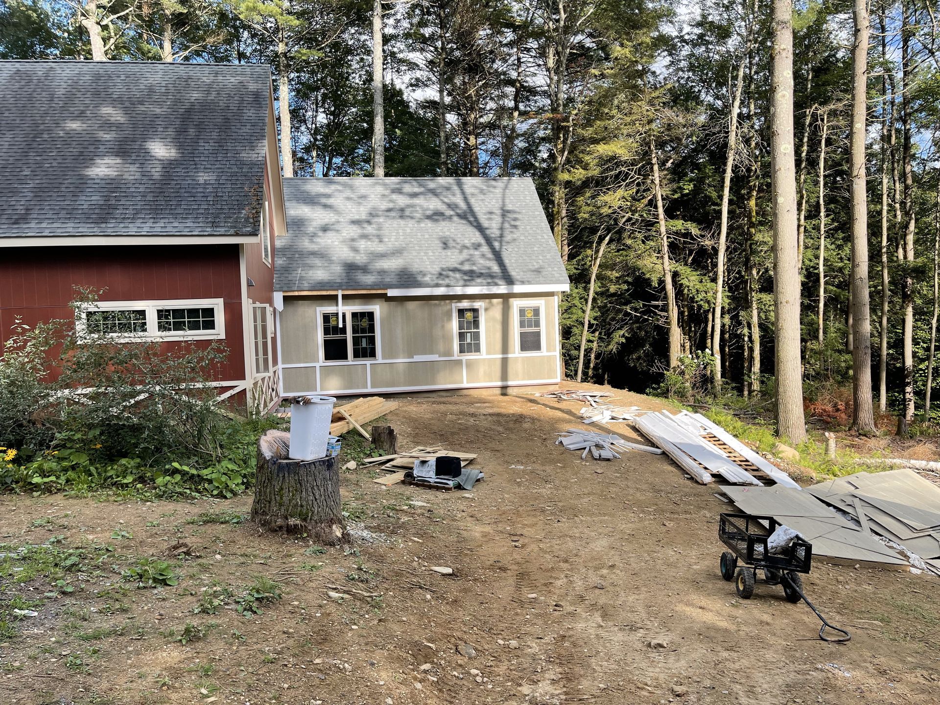 A room with a lot of cabinets and a window.