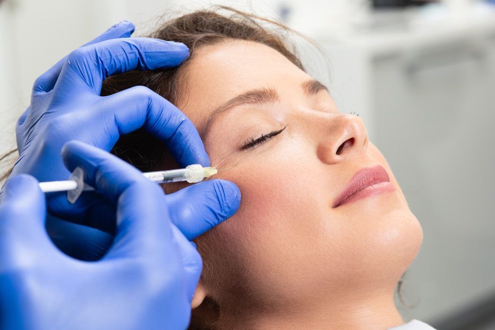 woman receiving cosmetic injectable treatment