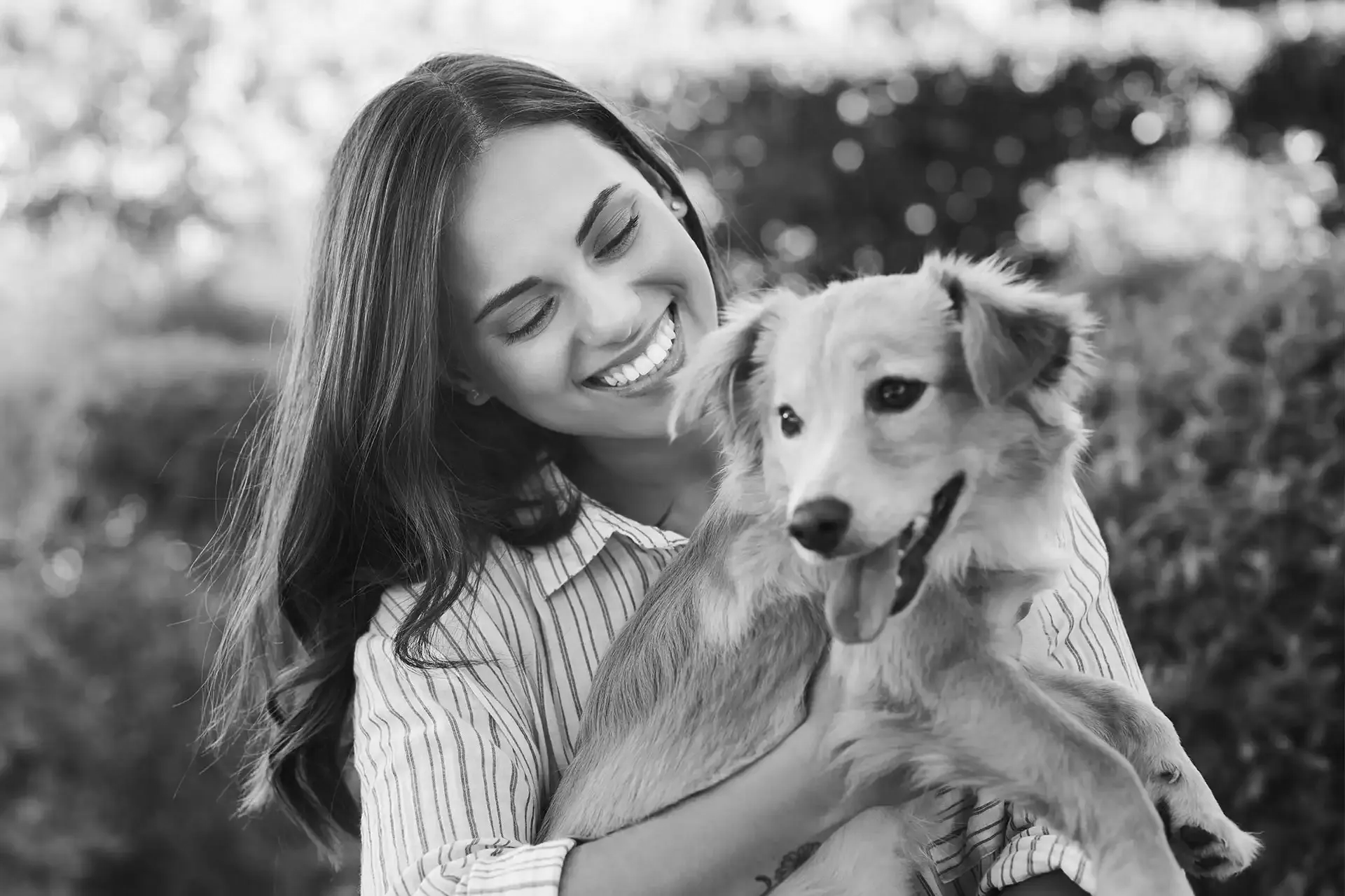 A woman with her dog outdoors