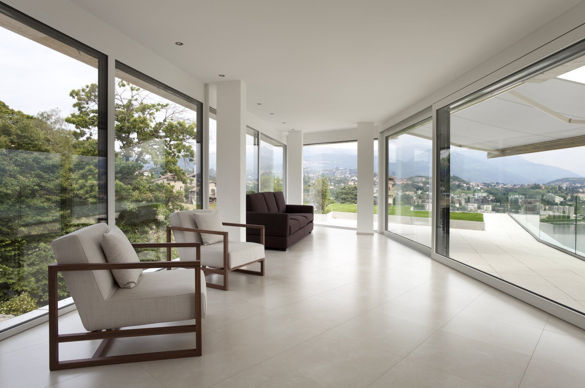 Door Repair — Modern Living Rooms with Brown Couch in Lincoln, NE