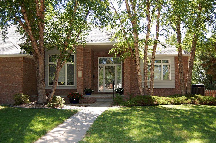 Installing and Replacing — Front Yard of a House in Lincoln, NE