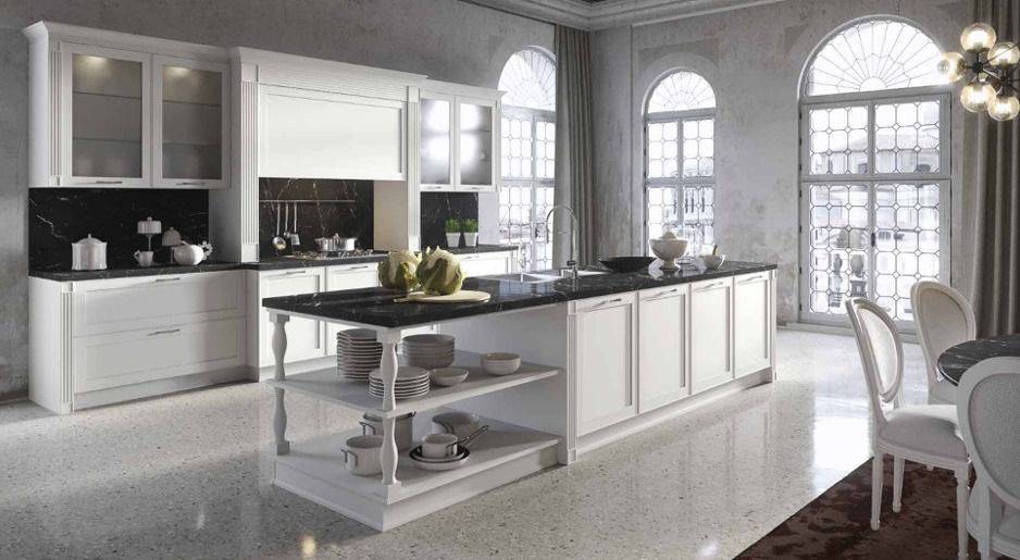 cucina con ampia isola e arredi bianchi