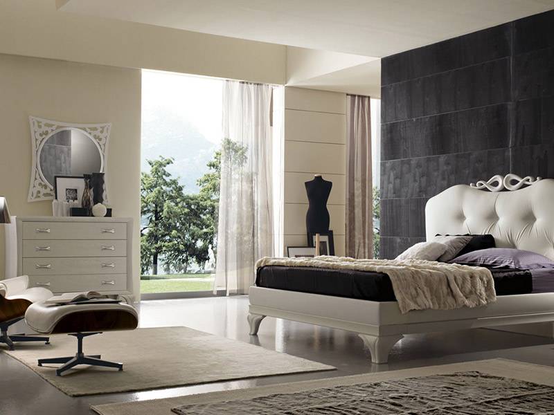 camera da letto con letto elegante e parete nera