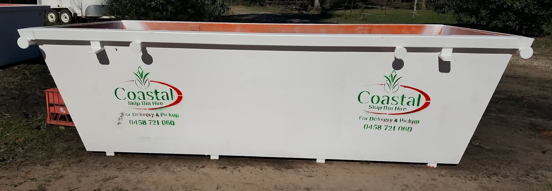 White Coastal Roll Off dumpster with logo on the side — Coastal Skip Bin Hire In Craignish, QLD