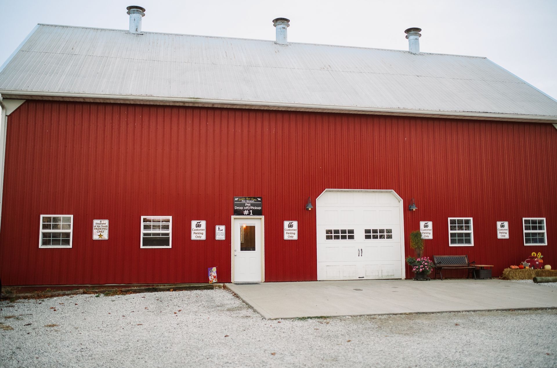 A large red barn with a white garage door