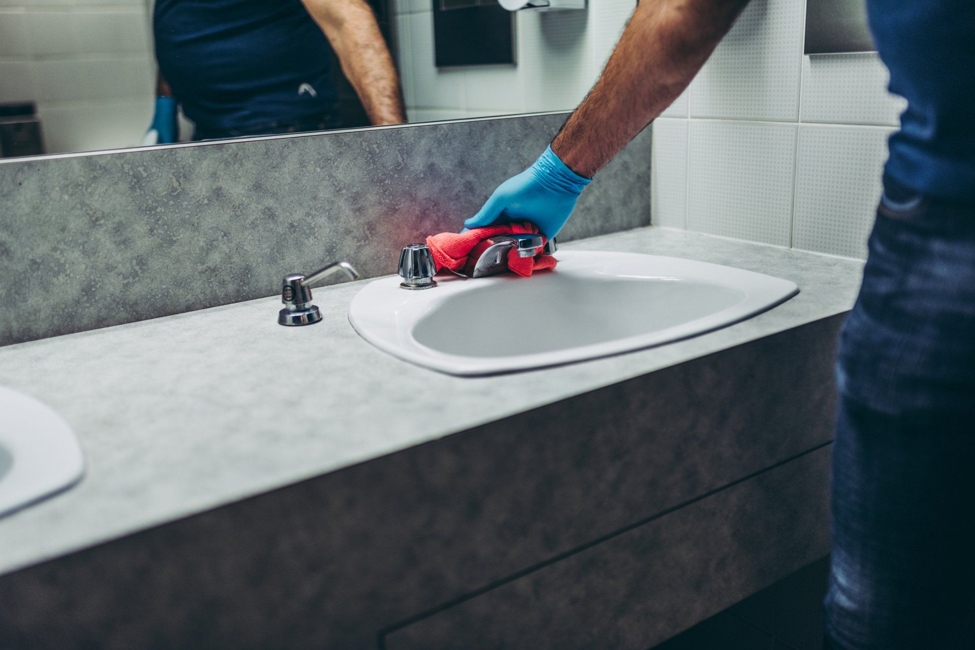 Janitor Cleaning the Bathroom — Sunshine Coast, QLD — Sunshine Coast Commercial Cleaners
