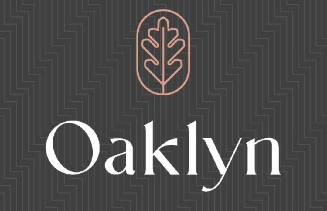 A logo for oaklyn with a leaf on it
