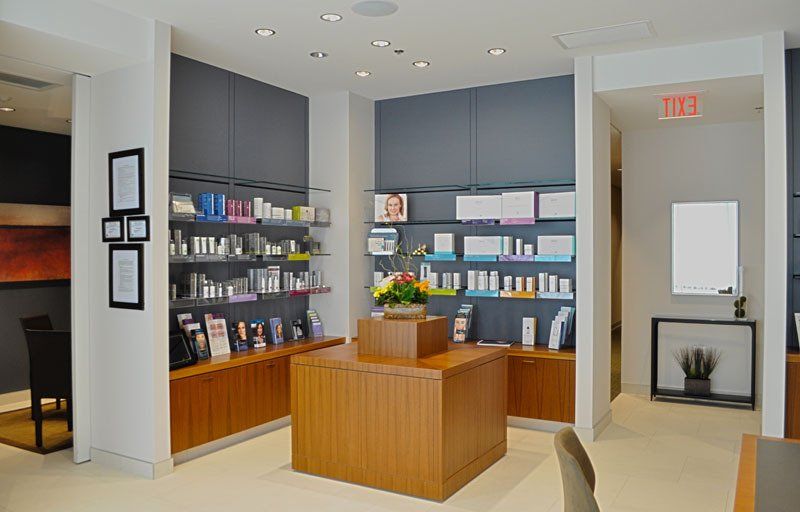 A large room with a wooden table in the middle of it.