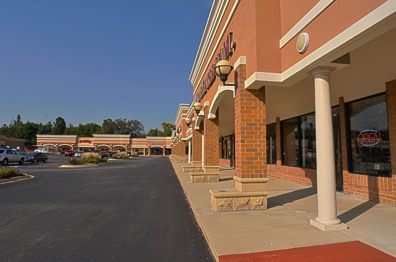 A brick building with a sign that says ' open ' on it