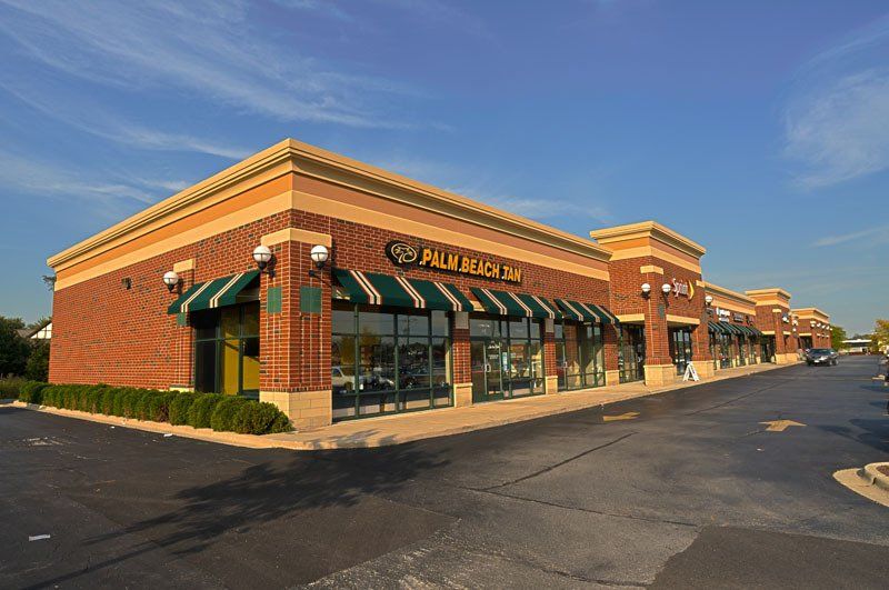 A brick building with a sign that says palm beach inn