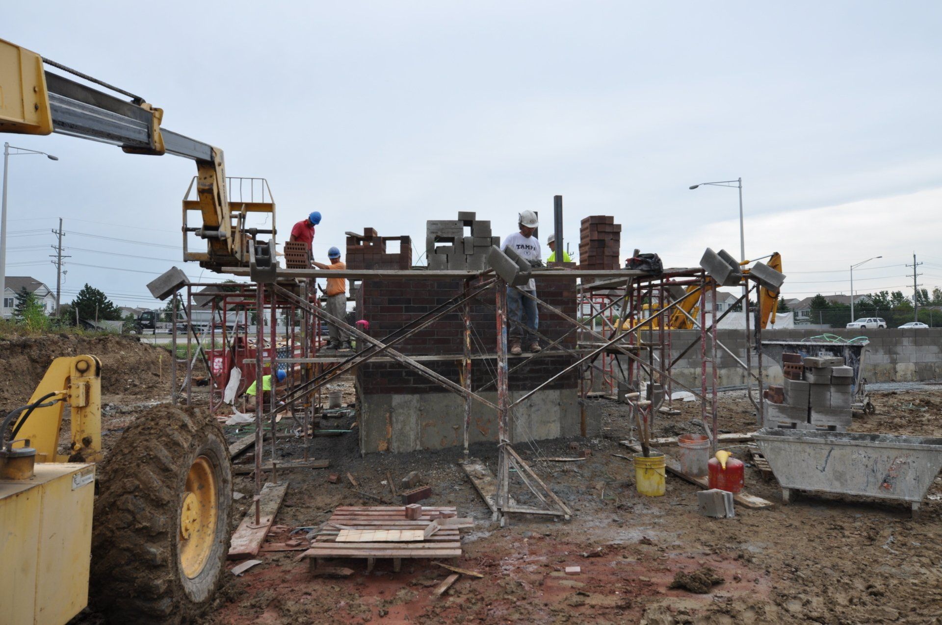 A group of construction workers are working on a construction site.