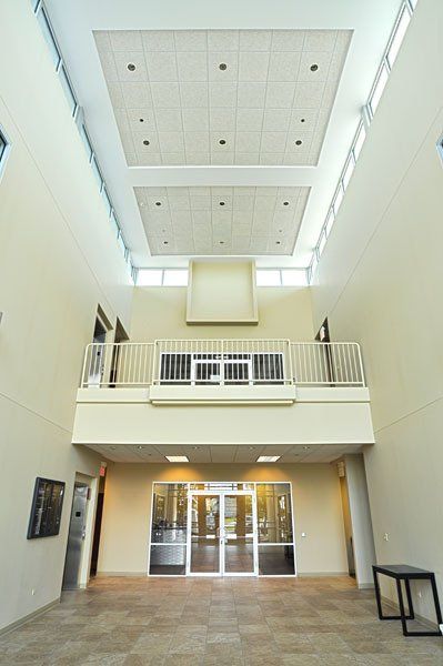 The inside of a building with a balcony and a door