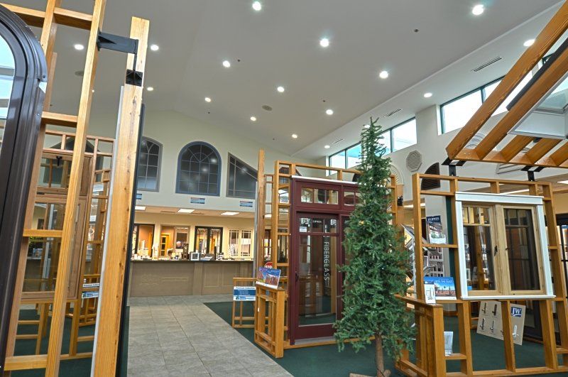 A building with a lot of windows and a christmas tree