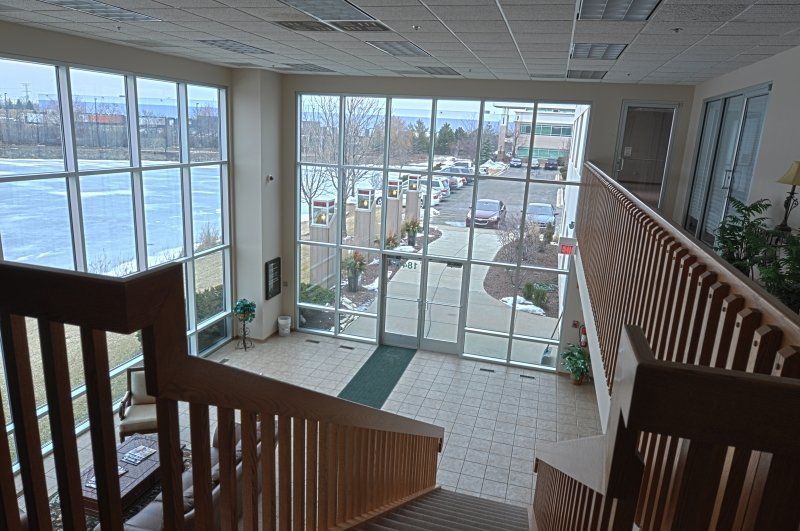 A view of a building from the top of a staircase.
