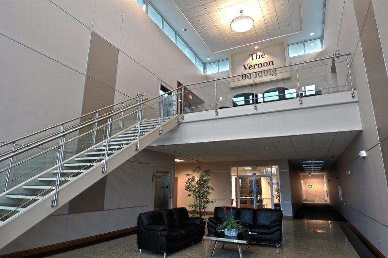 A lobby with stairs and a sign that says the vienna training
