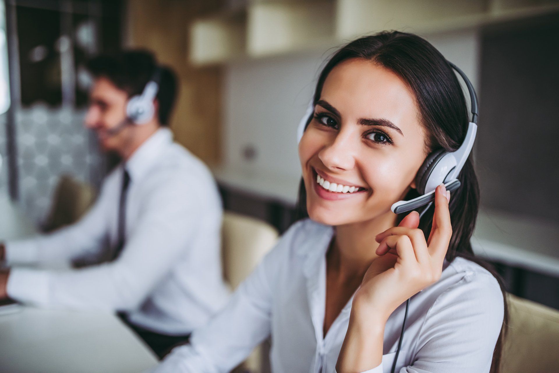 24/7 Answering Service — Call Center Workers in Headphones in Akron, OH