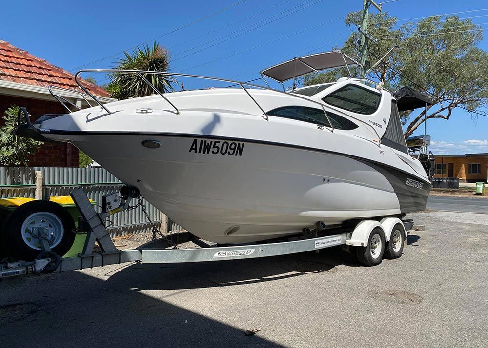A White Boat On A Trailer — Lavington Auto Electrical in Lavington, NSW
