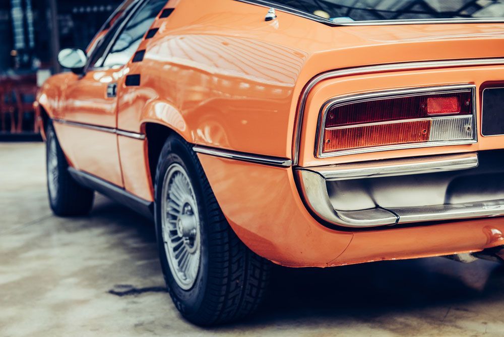 Vintage Orange Car in Classic Setting — Lavington Auto Electrical in Rutherglen, VIC