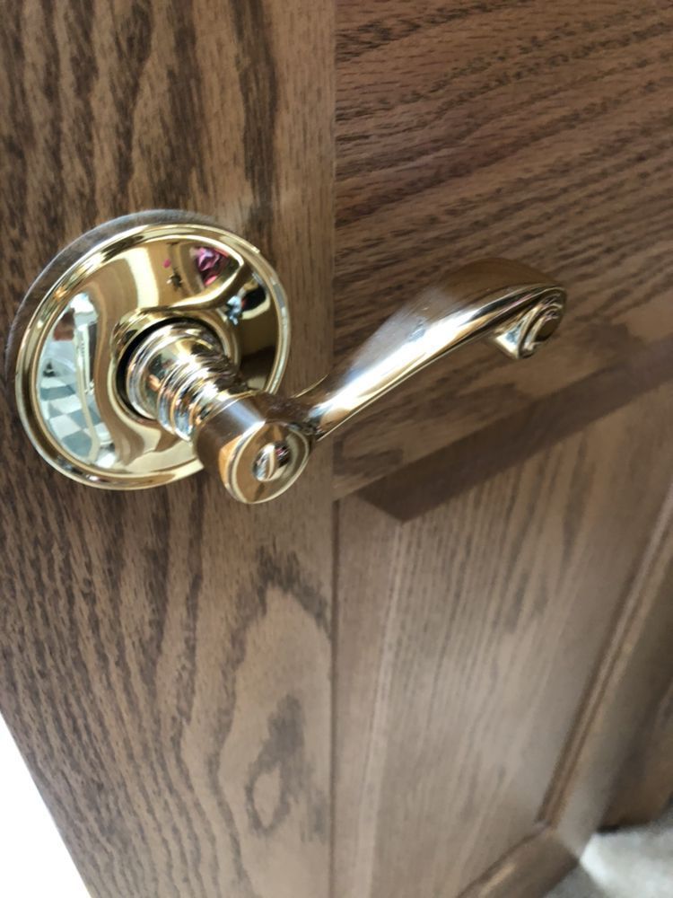 A large house with a lot of windows and a garage on a rainy day.