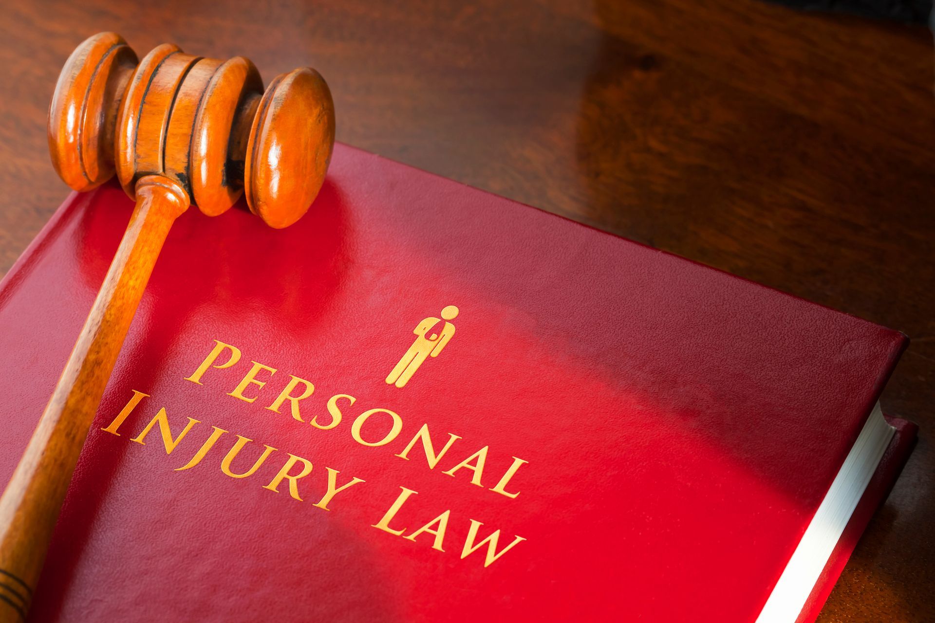 Book on personal injury law with a judge's gavel