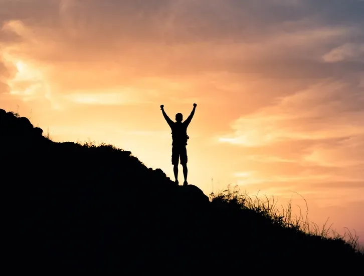 A Man Standing With Hands Up At Sunrise— Serene Therapy with Lana In Paddington, NSW