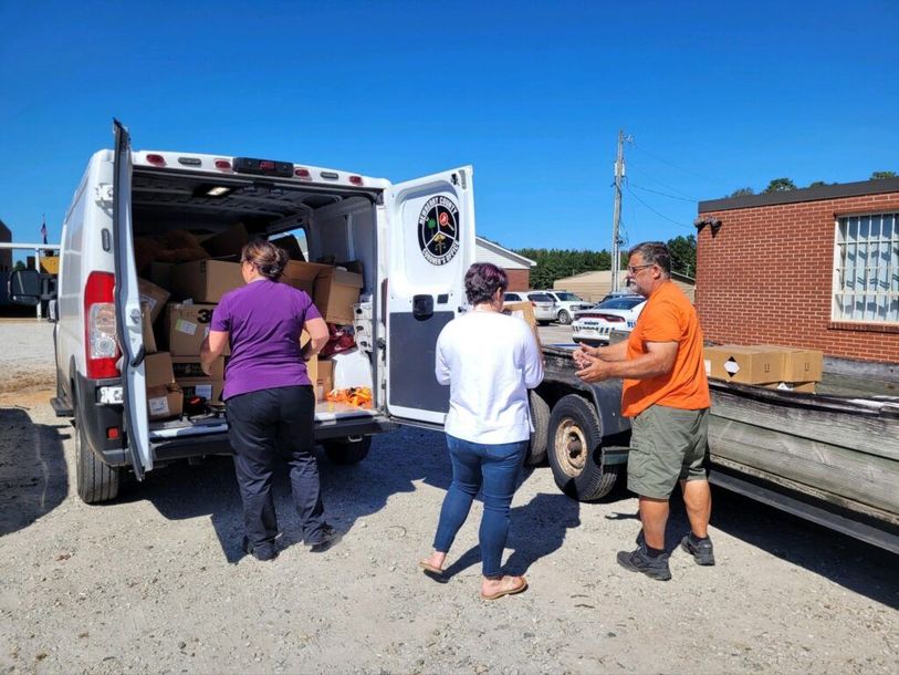 volunteers helping load trailers for United Ambassadors of Hope
