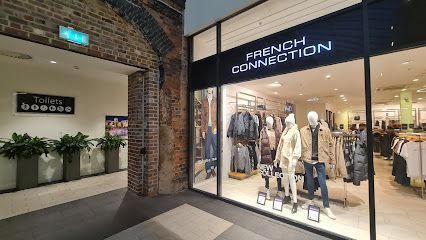 Exterior of French Connection clothing store in a shopping mall.