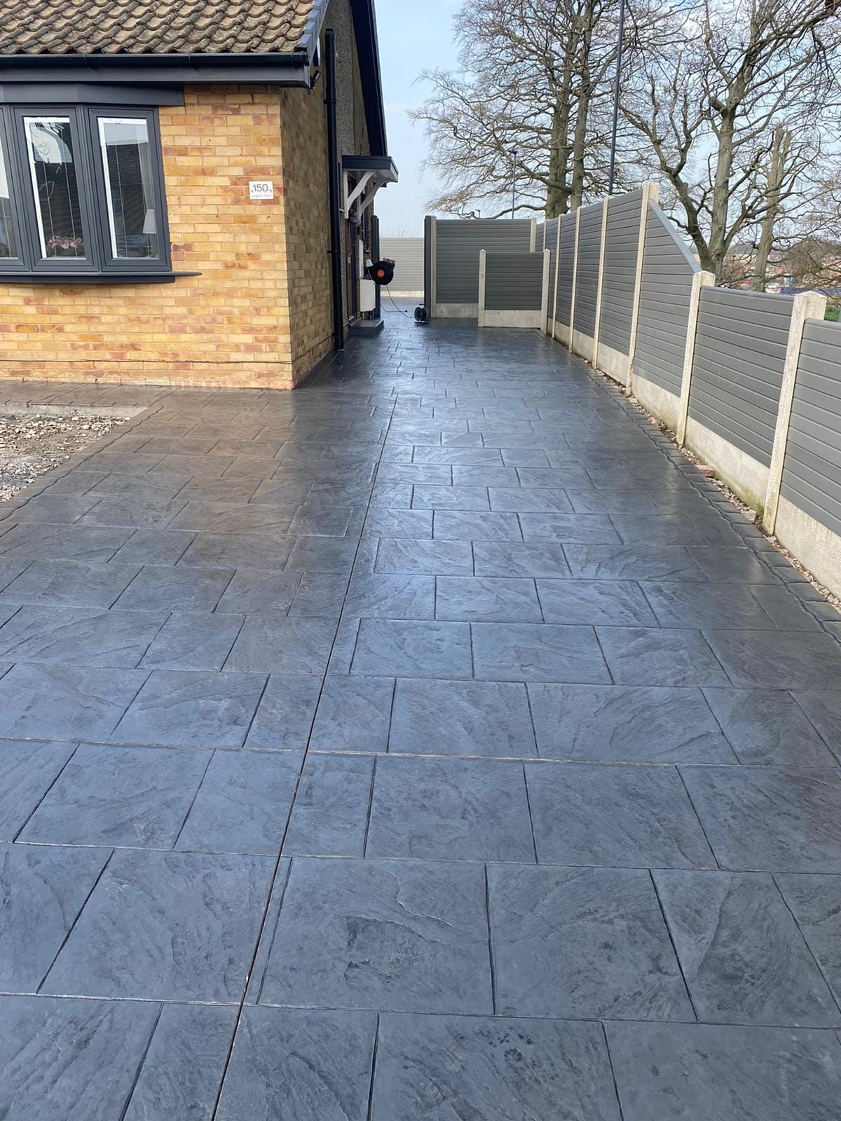 Close-up of a speckled granite surface with white, gray, and black granules.