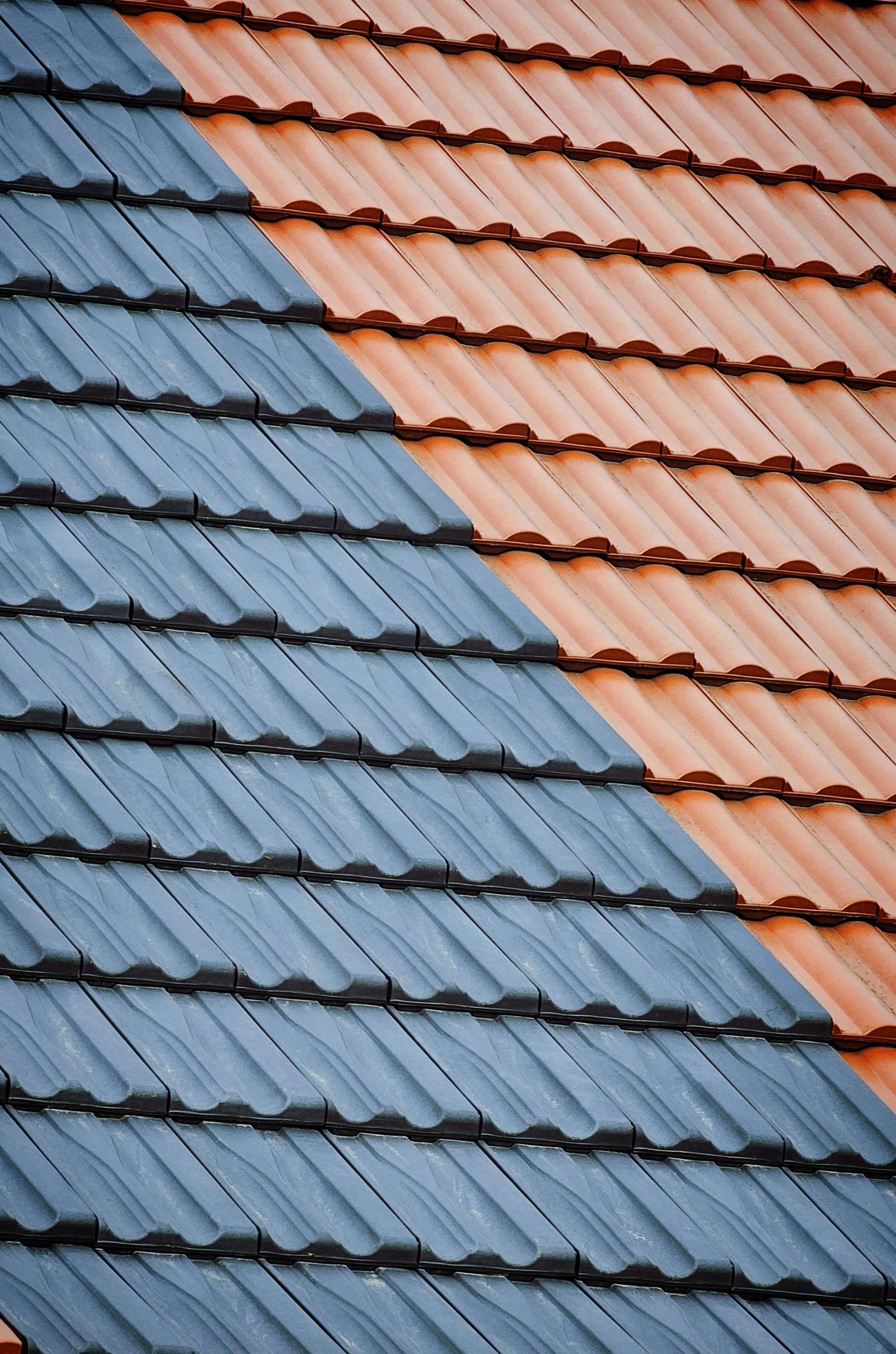 Blue and orange tiled roof sections divided by a diagonal line