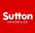 Logo de Sutton Immobilier en blanc sur fond rouge.