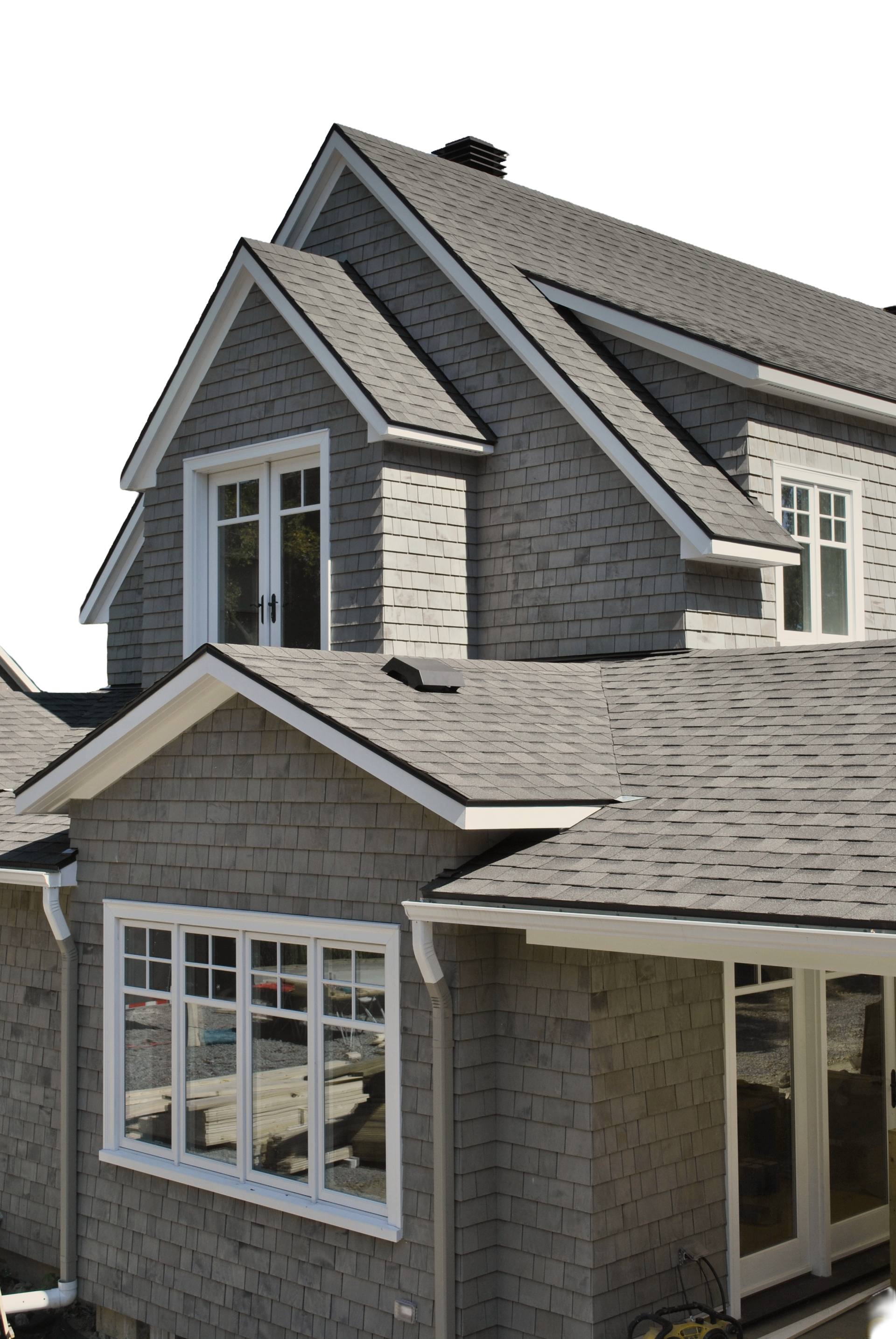 Gray house with shingle siding, white trim, and a gabled roof.