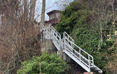 metal beach access staircase running down a cliffside