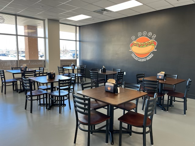 A diner with red and white checkered floors and tables