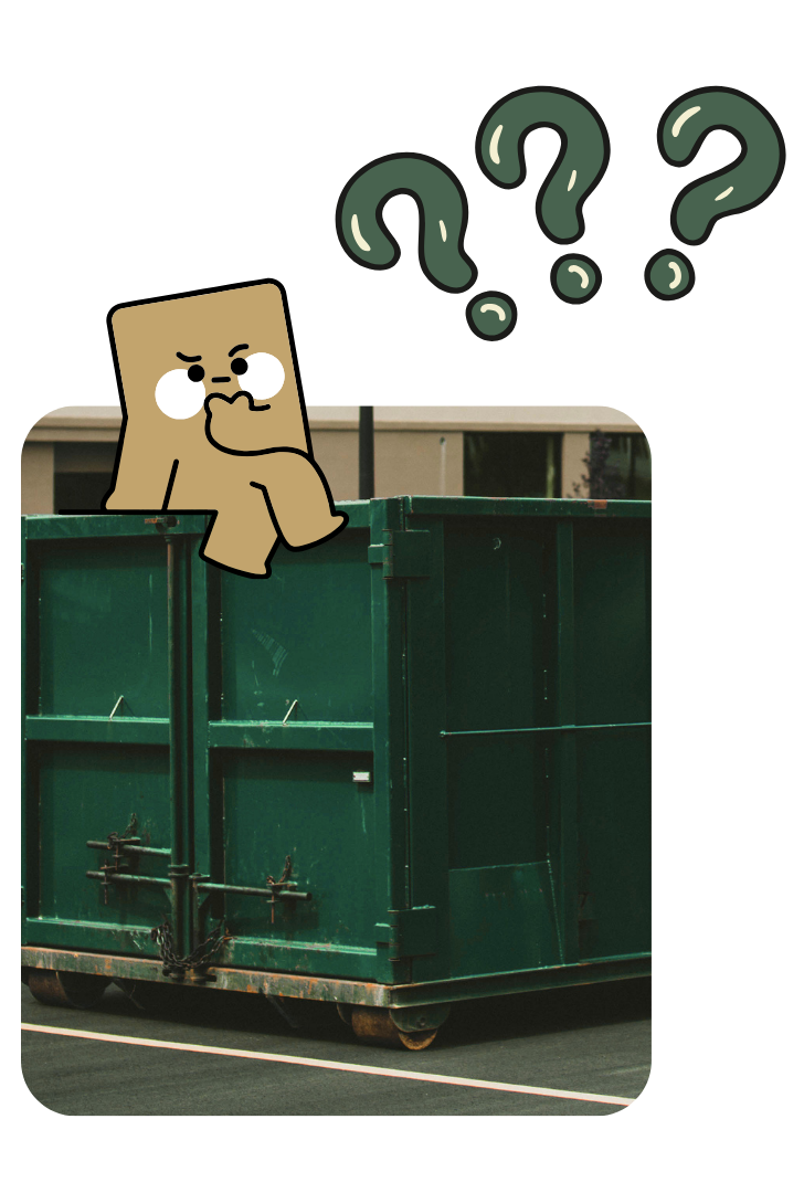 Construction team filling large dumpster with roofing materials