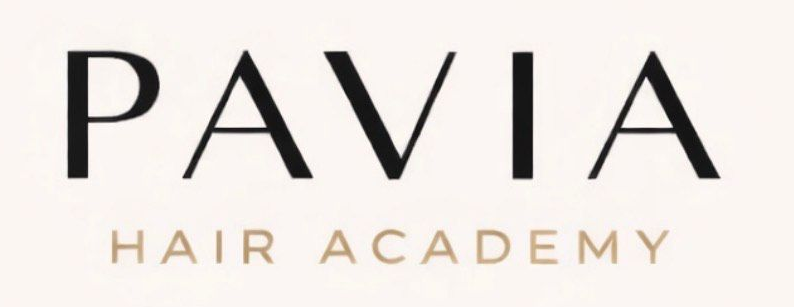 Logo for Pavia Salon. Black circle with cutout letters 