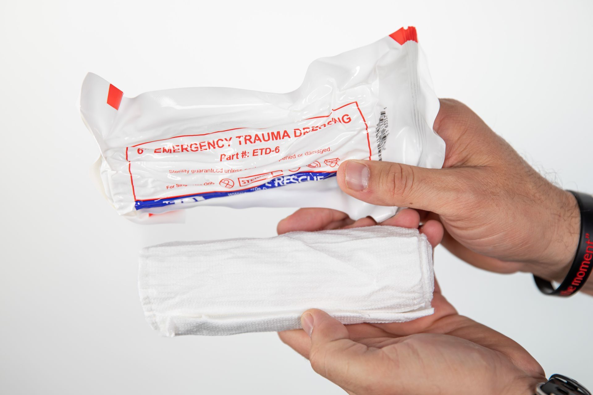 A first aid kit is sitting on a wooden table