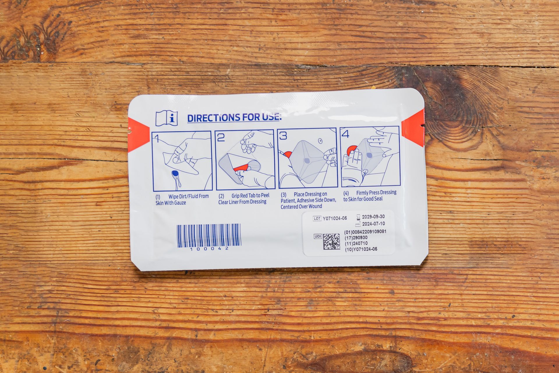 A person is holding a bag of hyfin wipes in their hands.