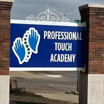 A blue sign that says professional touch academy